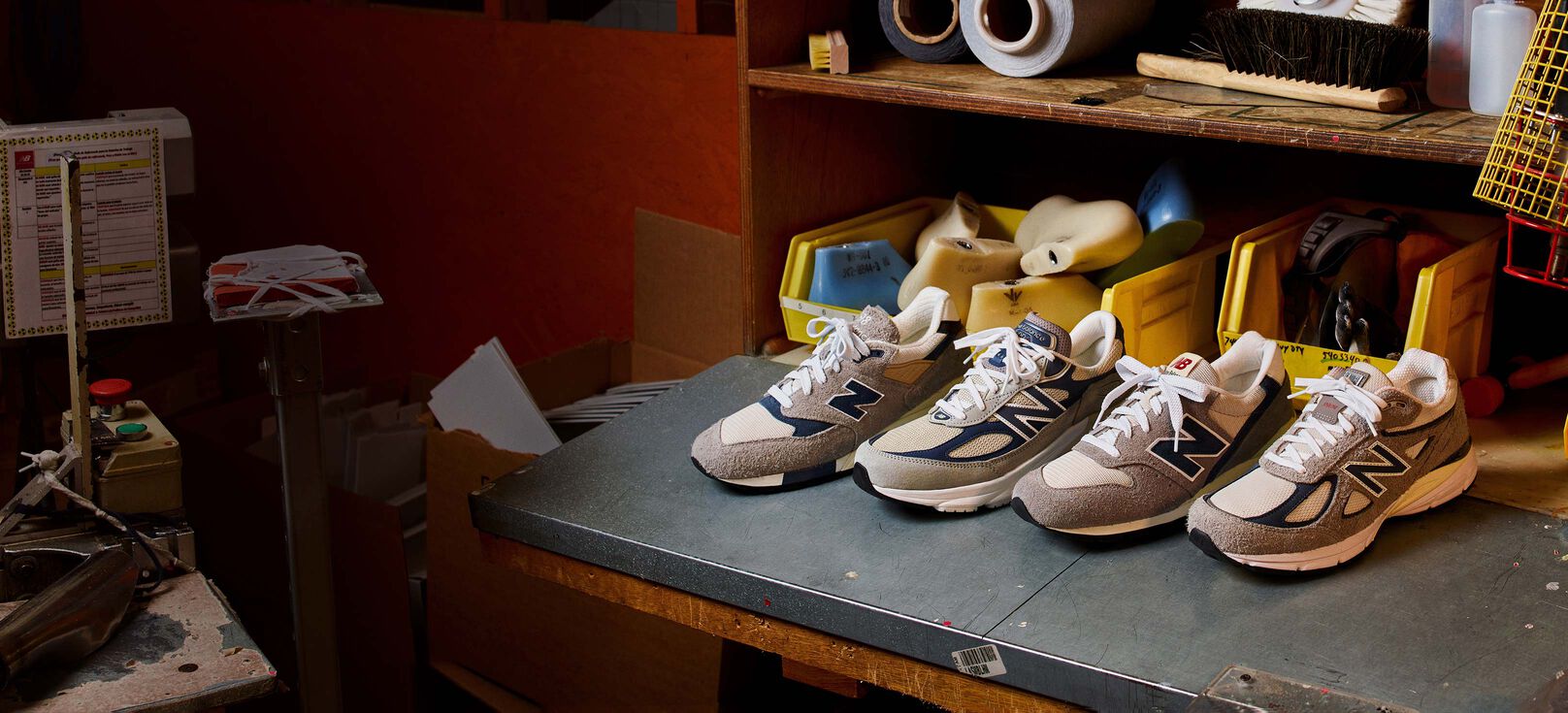 The four MADE in USA Grey Day Collection shoes sitting in a factory environment.