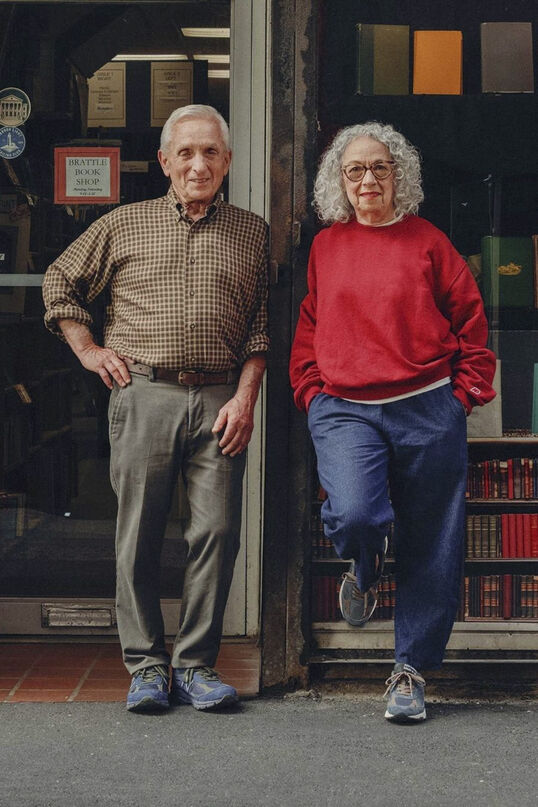  Man and woman standing with their hands in their pockets