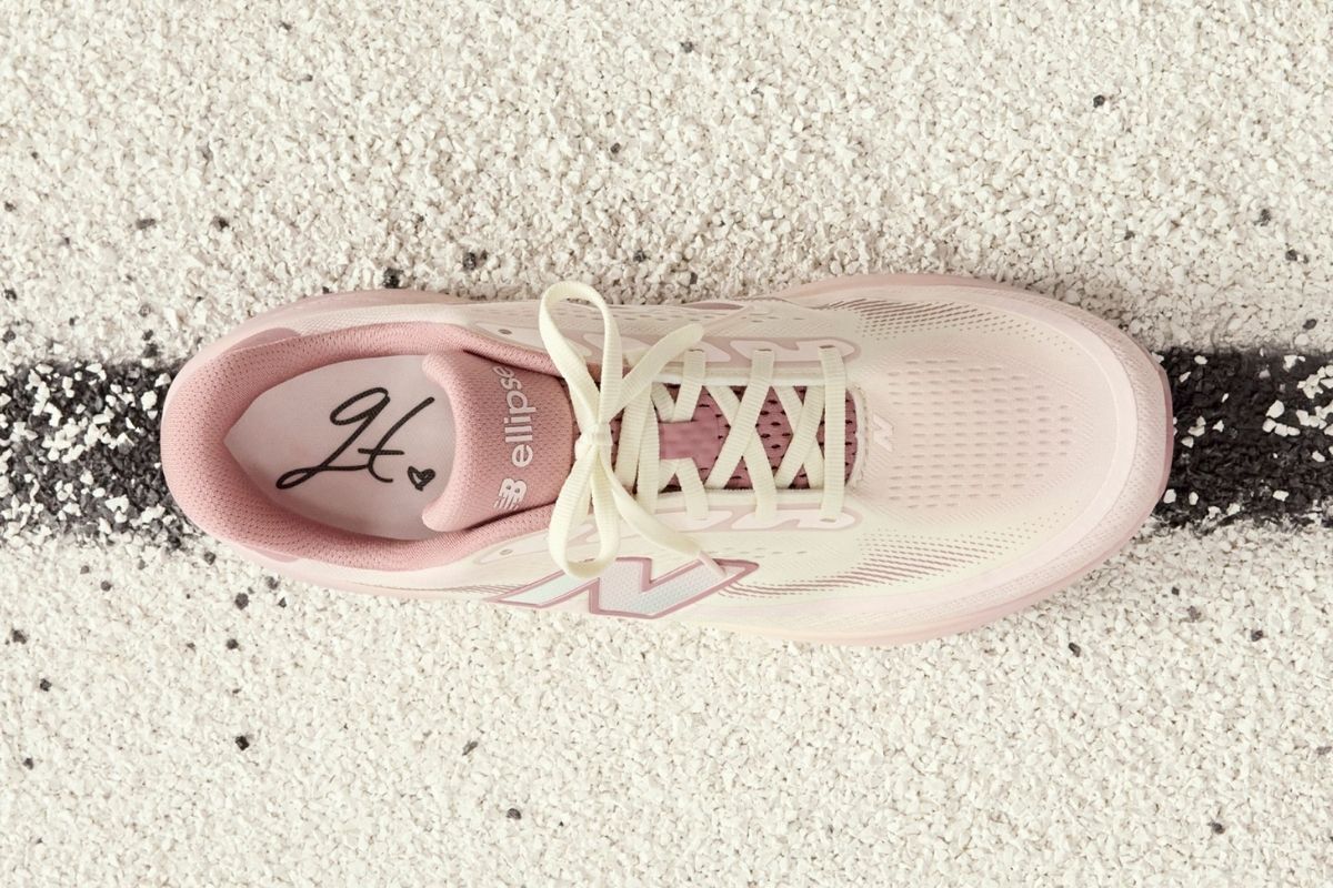 One pink Ellipse shoe on a track. 