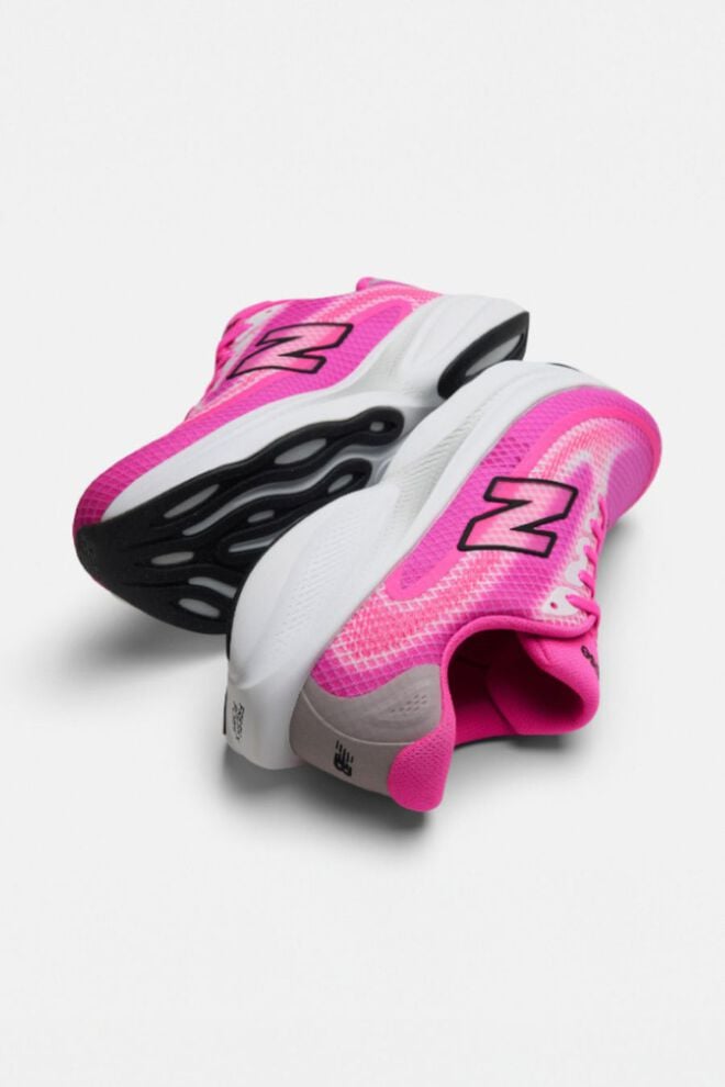 Pair of pink running shoes on a white background 