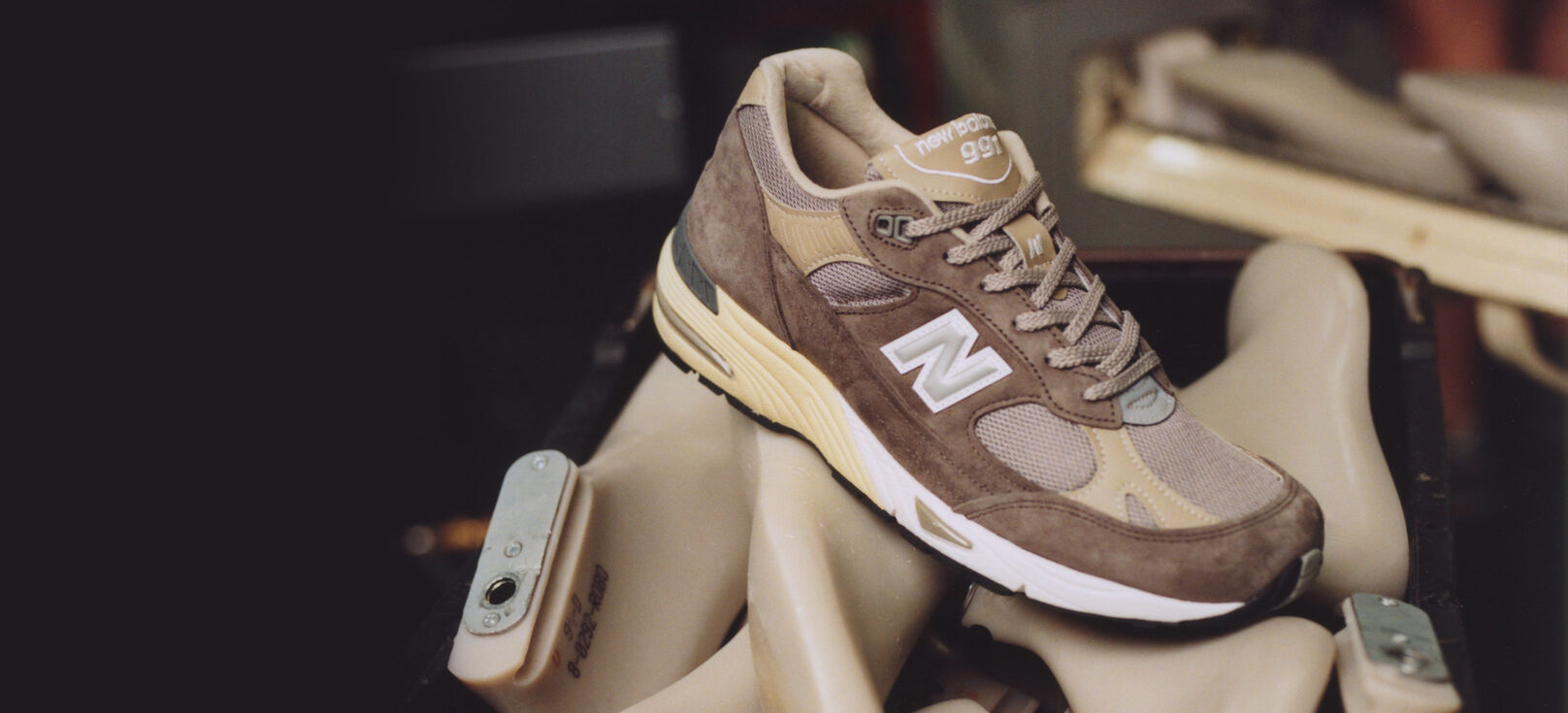 Grey Made in UK 991 in the Flimby factory sitting on a pile of manufacturing equipment.