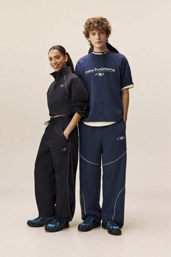  Man and woman standing with their hands in their pockets